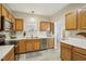 Modern kitchen featuring stainless steel appliances and light wood cabinets at 5809 Neuse Wood Dr, Raleigh, NC 27616