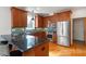 Modern kitchen with stainless steel appliances and granite countertops at 5920 Orchid Valley Rd, Raleigh, NC 27613