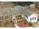 An aerial view showing the home's roof, porch, landscaping, and placement on the lot at 5920 Whittier Dr, Raleigh, NC 27609