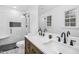 Bathroom with updated vanity, marble countertops, and a modern shower with glass door at 5920 Whittier Dr, Raleigh, NC 27609