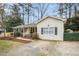 Attractive brick and siding home with a neatly paved driveway and well-kept front yard at 5920 Whittier Dr, Raleigh, NC 27609