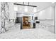 Modern kitchen with white cabinets, subway tile backsplash, and open dining area at 5920 Whittier Dr, Raleigh, NC 27609