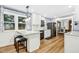 Eat-in kitchen features a breakfast bar with granite countertops and stainless appliances at 5920 Whittier Dr, Raleigh, NC 27609