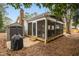 Relaxing screened porch with outdoor furniture and backyard views at 5920 Whittier Dr, Raleigh, NC 27609