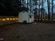 Backyard shed with lighting and a secure fence, providing extra storage space at 5920 Whittier Dr, Raleigh, NC 27609