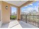 Cozy balcony with black railings offering neighborhood views, perfect for relaxing at 700 Finsbury St # 105, Durham, NC 27703