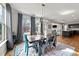 A stylish dining room showcases modern lighting, large windows, and a colorful rug at 75 Pearsall Farm Ln, Clayton, NC 27527