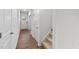 Bright hallway with wood-look floors and access to stairs at 7611 Michelle Rd, Rocky Mount, NC 27803