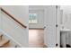 View down the stairs with a half bath and open living area at 7611 Michelle Rd, Rocky Mount, NC 27803