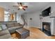 Spacious living room featuring a fireplace and hardwood floors at 7860 Silverthread Ln, Raleigh, NC 27617