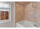 Clean bathroom with beige tile and a classic bathtub at 806 E Franklin St, Chapel Hill, NC 27514