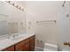 Clean bathroom with wood vanity and updated toilet at 806 E Franklin St, Chapel Hill, NC 27514