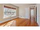 Well-lit bedroom featuring hardwood floors and large windows at 806 E Franklin St, Chapel Hill, NC 27514