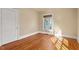 Bright bedroom with hardwood floors and a window at 806 E Franklin St, Chapel Hill, NC 27514