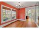 Charming dining room with hardwood floors, coral walls, and a chandelier at 806 E Franklin St, Chapel Hill, NC 27514