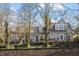 Charming two-story home with a metal roof and mature trees at 806 E Franklin St, Chapel Hill, NC 27514