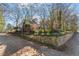 Side view of the house, showcasing stone wall and landscaping at 806 E Franklin St, Chapel Hill, NC 27514
