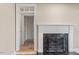 Elegant fireplace with marble surround and ornate screen at 806 E Franklin St, Chapel Hill, NC 27514