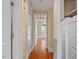 Clean hallway with hardwood floors and access to other rooms at 806 E Franklin St, Chapel Hill, NC 27514