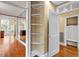 Hallway with corner shelving and access to other rooms at 806 E Franklin St, Chapel Hill, NC 27514