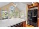 Bright kitchen with wood cabinets, an island, and stainless steel appliances at 806 E Franklin St, Chapel Hill, NC 27514