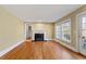 Living room features hardwood floors, fireplace, and large windows at 806 E Franklin St, Chapel Hill, NC 27514
