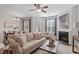 Spacious living room featuring a fireplace and ample natural light at 8252 Primanti Blvd, Raleigh, NC 27612