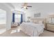 Spacious main bedroom with ceiling fan and sitting area at 8252 Primanti Blvd, Raleigh, NC 27612