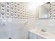 Small bathroom with white tile and a vintage vanity at 1113 W Mount Dr, Rocky Mount, NC 27803