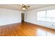 Bedroom with hardwood floors, ceiling fan, and access to bath at 1113 W Mount Dr, Rocky Mount, NC 27803