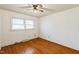 Well lit bedroom with hardwood floors and ceiling fan at 1113 W Mount Dr, Rocky Mount, NC 27803