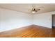 Spacious bedroom with hardwood floors and ceiling fan at 1113 W Mount Dr, Rocky Mount, NC 27803