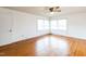 Bright bedroom with hardwood floors and ceiling fan at 1113 W Mount Dr, Rocky Mount, NC 27803