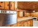 Vintage kitchen features with wood cabinets and stove at 1113 W Mount Dr, Rocky Mount, NC 27803