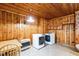 Shared laundry with washer, dryer, and wood paneling at 1113 W Mount Dr, Rocky Mount, NC 27803