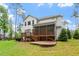 Beautiful backyard view with a screened porch, a patio and stairs to the yard at 1141 Barley Stone Way, Raleigh, NC 27603
