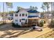 Spacious backyard with a patio, deck, and lush greenery, perfect for outdoor activities at 1141 Barley Stone Way, Raleigh, NC 27603