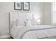 Cozy bedroom featuring a comfortable bed with white linens, a shuttered window, and neutral decor at 1141 Barley Stone Way, Raleigh, NC 27603