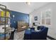 Charming bedroom featuring built-in shelves and a calming blue accent wall at 1141 Barley Stone Way, Raleigh, NC 27603