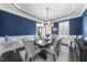 Elegant dining room features dark wood floors, crown molding, and wainscotting at 1141 Barley Stone Way, Raleigh, NC 27603
