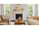 Close up of the living room fireplace with a decorative mirror and mantel at 1141 Barley Stone Way, Raleigh, NC 27603