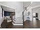 Spacious foyer features a staircase, hardwood floors, and elegant trim work at 1141 Barley Stone Way, Raleigh, NC 27603