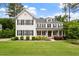 Charming two-story home with a beautifully landscaped front yard and a welcoming front porch at 1141 Barley Stone Way, Raleigh, NC 27603