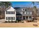 Charming two-story traditional home with welcoming front porch and well-manicured lawn at 1141 Barley Stone Way, Raleigh, NC 27603
