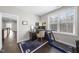 Bright home office with a corner desk, treadmill, and a large window providing natural light at 1141 Barley Stone Way, Raleigh, NC 27603