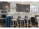 Kitchen island with barstool seating and pendant lighting, ideal for casual dining at 1141 Barley Stone Way, Raleigh, NC 27603