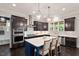 Bright kitchen featuring a blue island and stainless steel appliances at 1141 Barley Stone Way, Raleigh, NC 27603