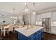 Open concept kitchen with an island and stainless steel appliances at 1141 Barley Stone Way, Raleigh, NC 27603