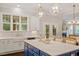 Bright eat-in kitchen with stainless steel appliances and island with custom cabinetry at 1141 Barley Stone Way, Raleigh, NC 27603