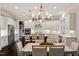 Modern kitchen with an island, stainless steel appliances, and an eat-in area at 1141 Barley Stone Way, Raleigh, NC 27603